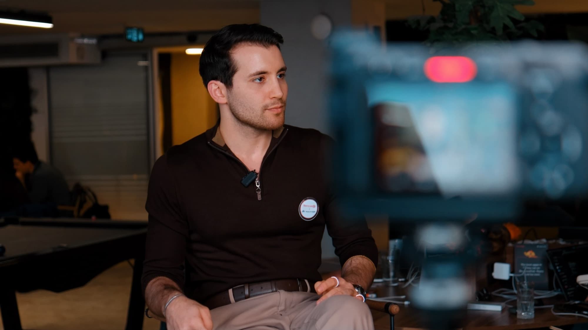 Tyler Blackford, founding partner of Neon Apps, being interviewed on camera at the Istanbul office