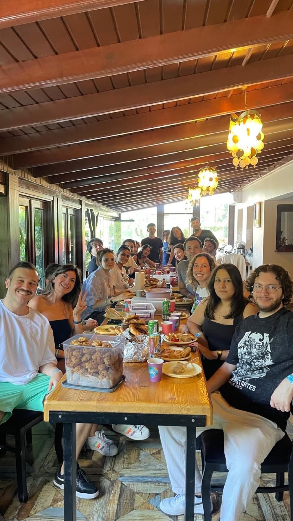 The Neon Apps team at a long table at the company summer party