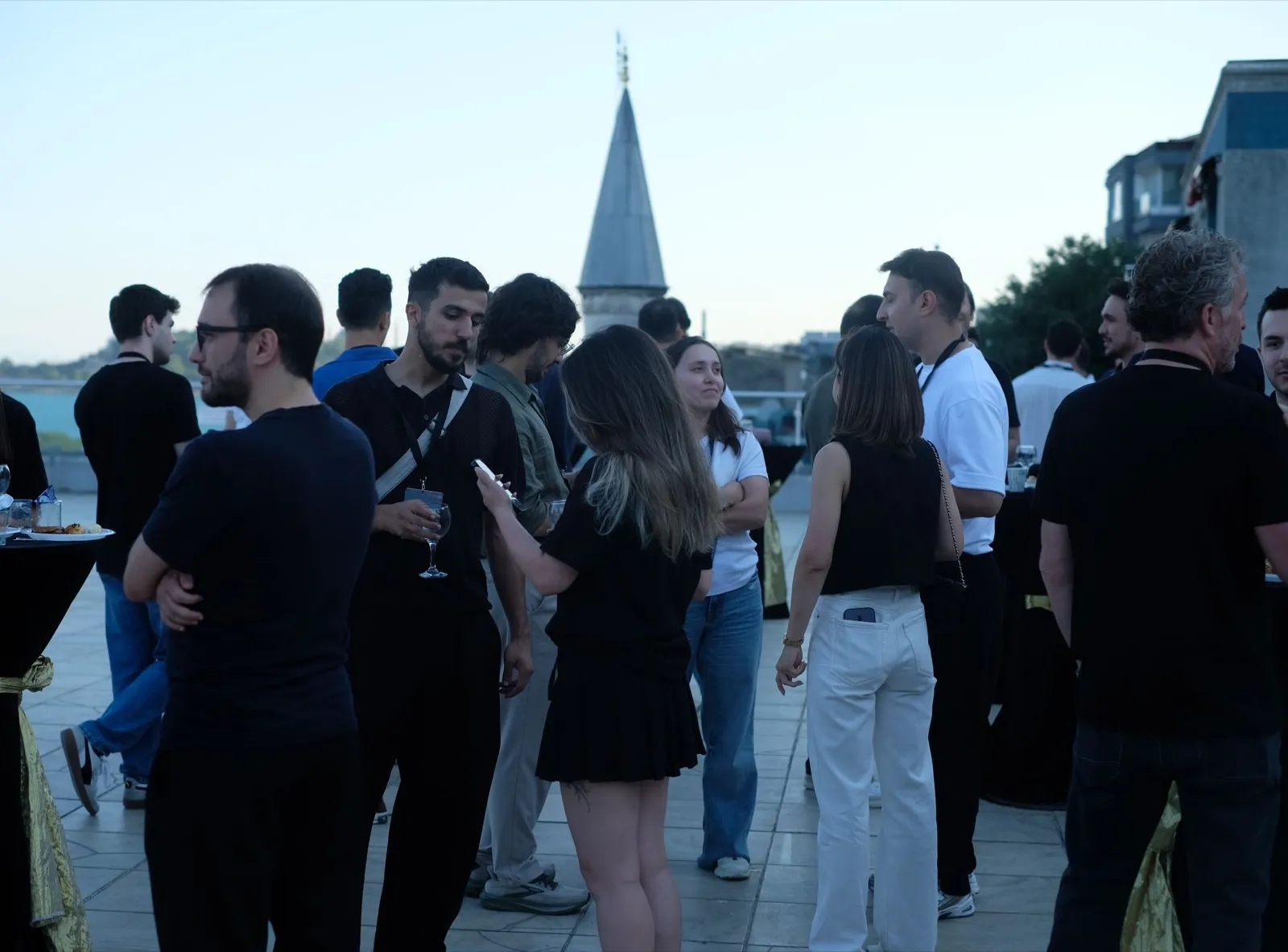Founders and investors on the Bosphorus terrace at dusk during the Neon Apps and RevenueCat App Growth Championship finale in Istanbul