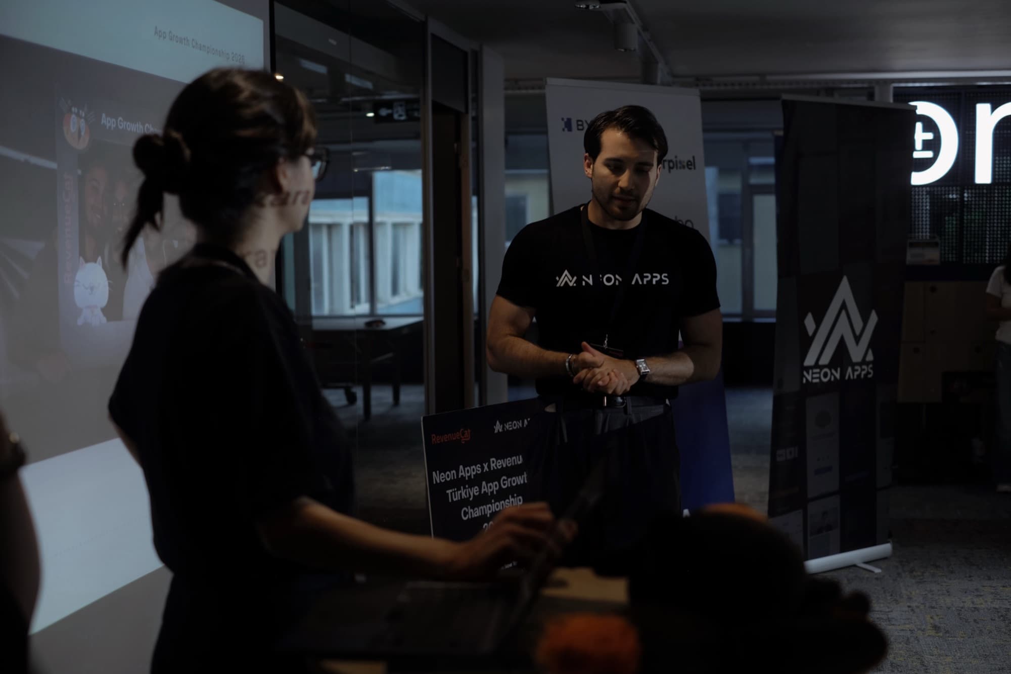Tyler Blackford of Neon Apps at the App Growth Championship in Istanbul, 2026, in front of the Neon Apps and RevenueCat banners